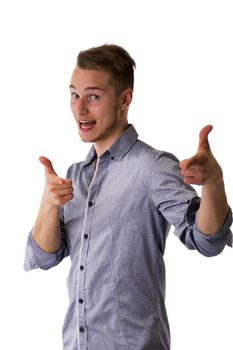 Happy attractive young man pointing fingers at camera with cool gesture