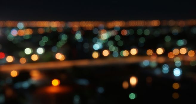 Night lights bokeh of a wide variety of colors including red, green, yellow, blue, orange.                              