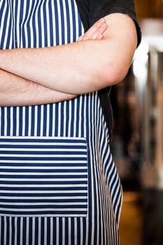 Cook Closeup in the Kitchen with Crossed arms in a Portuguese restaurant