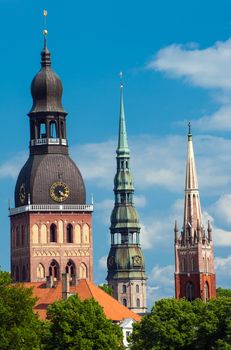  Three church towers in the picture are the Riga Dome cathedral,  St. Saviour's Church and St. Peter's church.