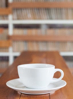 Coffee cup on wooden table, stock photo