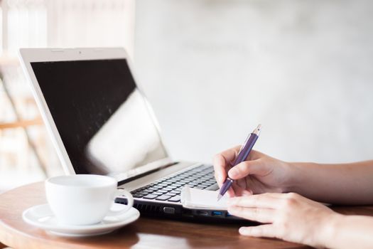 Closeup woman working in coffee shop, stock photo