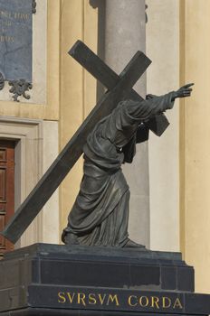 Sculpture of Jesus Christ carrying the Cross (1858) in front of the main entrance to the Church of the Holly Cross, Warsaw, Poland.