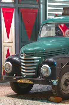 An old truck parked in the gate one of the most popular restaurant, Warsaw, Poland.