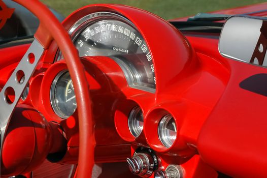 bright red dashboard from a classic car