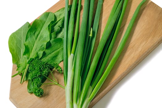 Leaves of parsley, green onions and ����������. Are presented on a white background.