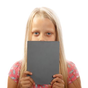 A blonde young girl holding a gray paper board