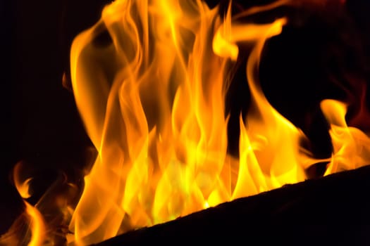 Photo with red flame on black background