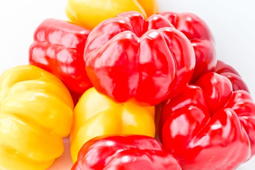 Photo of red and yellow raw pepper