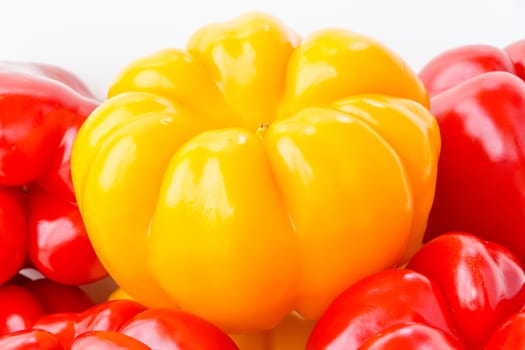 Photo of red and yellow raw pepper