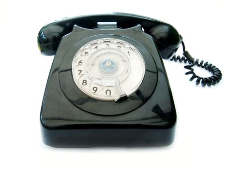 Vintage telephone over a white background
