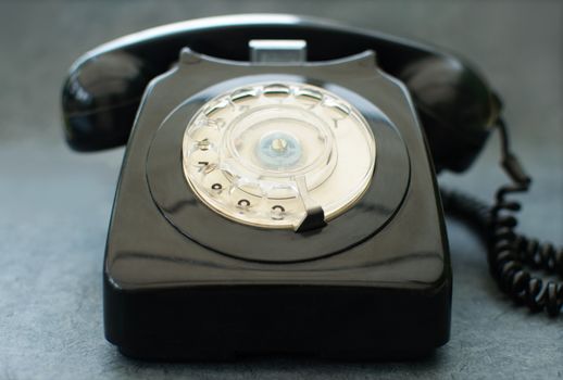Old black vintage telephone close up