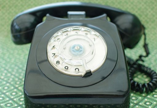 Old black vintage telephone close up