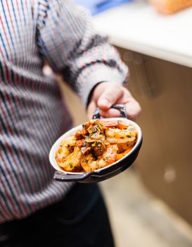 Man Presenting a Typical Tradional Portugese Shrimp Meal