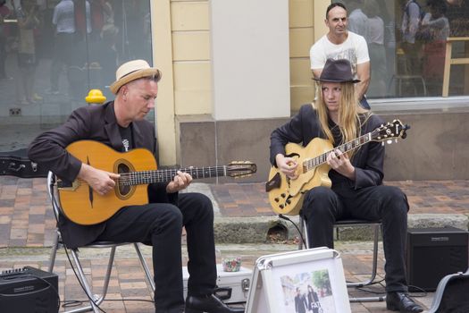 Sydney, Australia- 23th March 2013: Buskers perform in the Rocks area of the city. Buskers must be approved and can only perform in permitted areas in Sydney.
