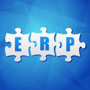 ERP - text in white puzzle pieces over blue background, flat design, enterprise resource planning systems, business concept