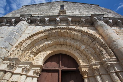 Archivolts detail in the  main entrance of the romanesque Retaud church,Charente, France