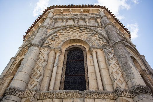 Abse window of the romanesque Rioux church. Region of Charente in France