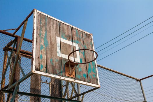 Low angle view of old basketball board without net on hoop