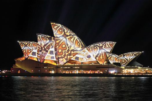 SYDNEY, AUSTRALIA - JUNE 2, 2014;  Vivid Sydney Festival, reptile snakeprint pattern projected onto the  Sydney Opera House i during Vivid  annual festival of light, music and ideas