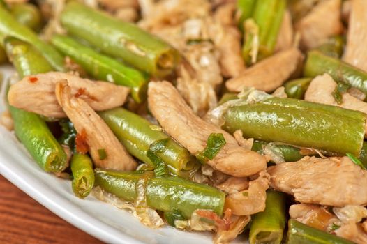 Tasty green beans with chicken meat
