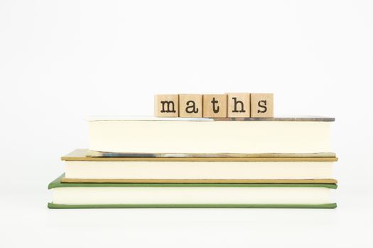 maths word on wood stamps stack on books