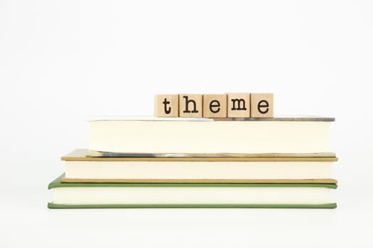 theme word on wood stamps stack on books