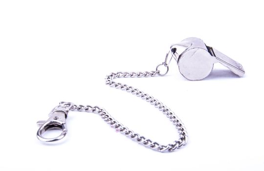 the beautiful world cup whistle with stainless steal ornamental chain
on the white background