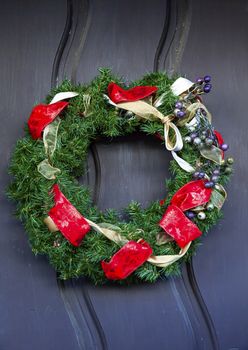 Christmas Wreath Decoration Red Ribbons, Mission San Luis Obispo de Tolosa San Luis Obispo California.  Founded 1772 by  Father Junipero Serra.  Named for Saint Louis of Anjou