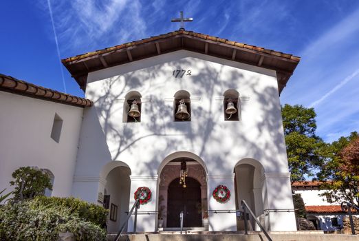 Mission San Luis Obispo de Tolosa Facade Cross Bells Christmas Wreaths San Luis Obispo California.  Founded 1772 by  Father Junipero Serra.  Named for Saint Louis of Anjou