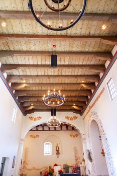 Mission San Luis Obispo de Tolosa, Basilica, Wooden Ceiling, Chandelier, San Luis Obispo California.  Founded 1772 by  Father Junipero Serra.  Named for Saint Louis of Anjou