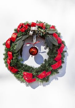 Christmas Wreath Decoration Red Ribbons, Mission San Luis Obispo de Tolosa San Luis Obispo California.  Founded 1772 by  Father Junipero Serra.  Named for Saint Louis of Anjou