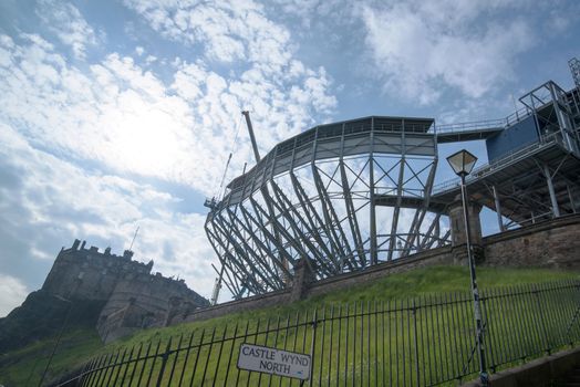 EDINBURGH, SCOTLAND - MAY 31, 2014: Edinburgh Castle on Castle Rock in Edinburgh, Scotland, UK is getting ready for its famous military tattoo festival with tribunes being mounted along the entrance walls on May 31, 2014 in Edinburg, Scotland, United Kingdom.