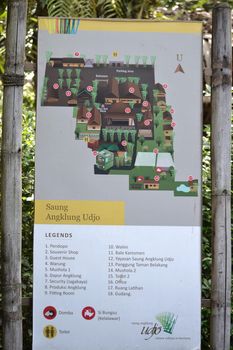 bandung, indonesia-june 16, 2014: saung angklung udjo area map sign displayed in front of main entrance gate.
