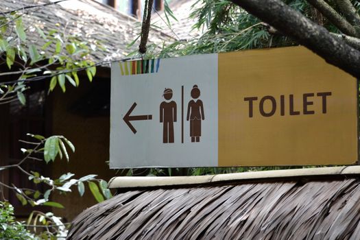bandung, indonesia-june 16, 2014: saung angklung udjo toilet sign displayed in front of main entrance gate.