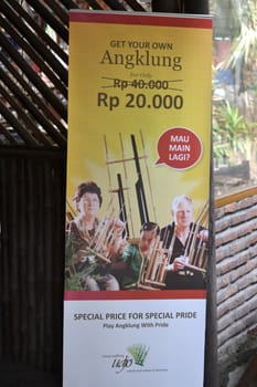 bandung, indonesia-june 16, 2014: saung angklung udjo banner displayed in front of main entrance gate.