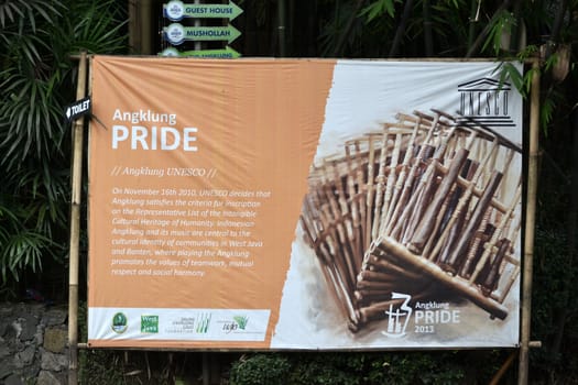 bandung, indonesia-june 16, 2014: saung angklung udjo banner displayed in front of main entrance gate.