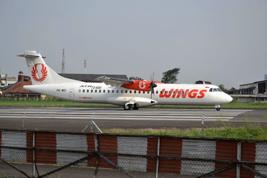 bandung, indonesia-june 16, 2014: Wings Air airplane taking manoeuvre on husein sastranegara airport bandung.