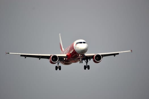 bandung, indonesia-june 16, 2014: Air Asia airplane taking manoeuvre on husein sastranegara airport bandung.