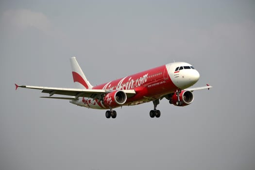 bandung, indonesia-june 16, 2014: Air Asia airplane taking manoeuvre on husein sastranegara airport bandung.