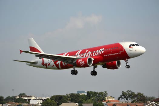 bandung, indonesia-june 16, 2014: Air Asia airplane taking manoeuvre on husein sastranegara airport bandung.
