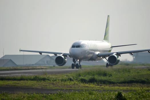 bandung, indonesia-june 16, 2014: Citilink airplane taking manoeuvre on husein sastranegara airport bandung.