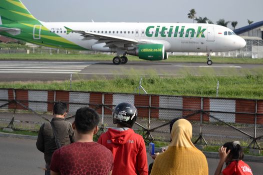 bandung, indonesia-june 16, 2014: Citilink airplane taking manoeuvre on husein sastranegara airport bandung.