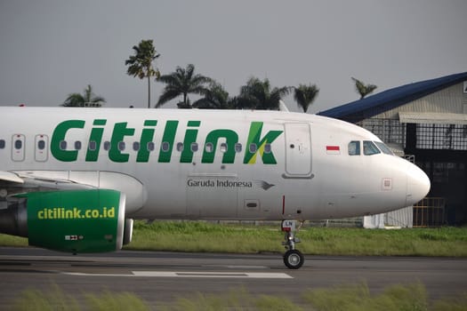 bandung, indonesia-june 16, 2014: Citilink airplane taking manoeuvre on husein sastranegara airport bandung.
