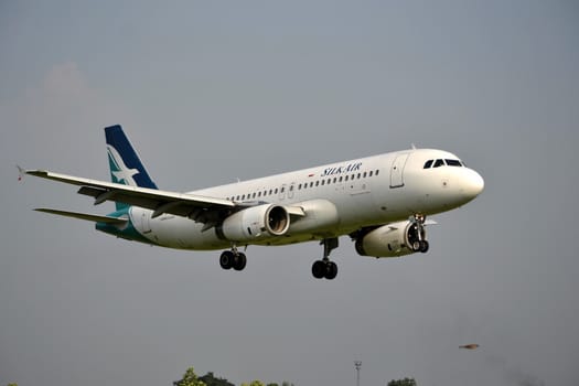 bandung, indonesia-june 16, 2014: Silk Air airplane taking manoeuvre on husein sastranegara airport bandung.