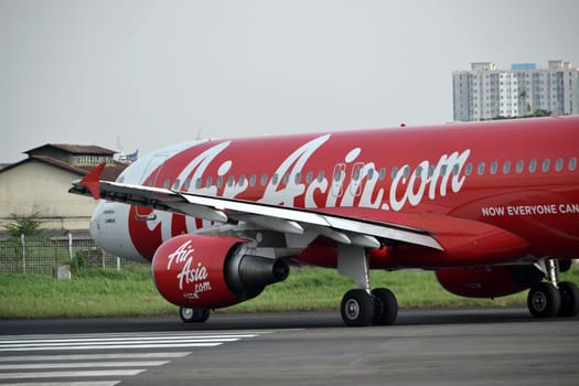 bandung, indonesia-june 16, 2014: Air Asia airplane taking manoeuvre on husein sastranegara airport bandung.