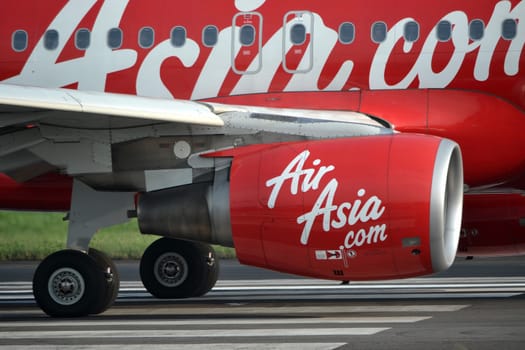 bandung, indonesia-june 16, 2014: Air Asia airplane taking manoeuvre on husein sastranegara airport bandung.