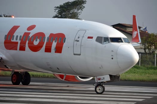 bandung, indonesia-june 16, 2014: Lion Air airplane taking manoeuvre on husein sastranegara airport bandung.