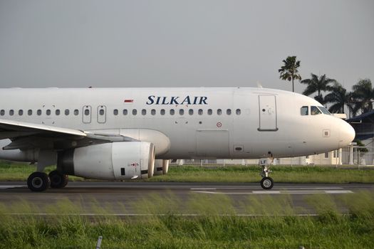 bandung, indonesia-june 16, 2014: Silk Air airplane taking manoeuvre on husein sastranegara airport bandung.