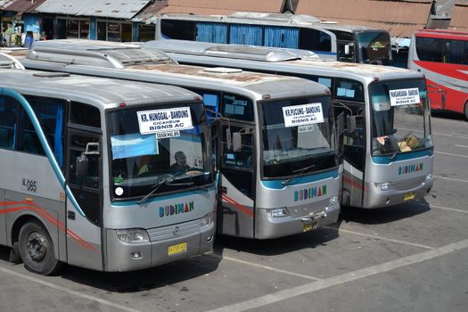 bandung, indonesia-june 16, 2014: bus parking at cicaheum bus station waiting for passenger to board.